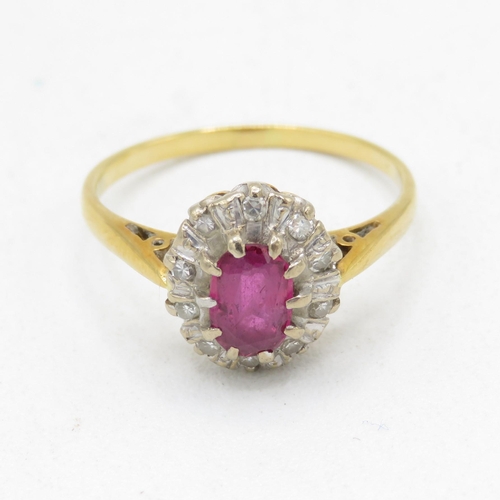 121 - 18ct gold ruby and diamond cluster dress ring (3g) Size  M