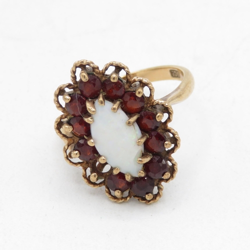 129 - 9ct gold vintage marquis opal and garnet halo cocktail ring (4.1g) Size  L