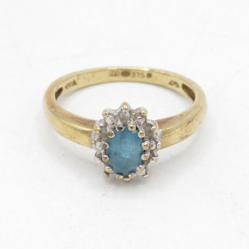 46 - 9ct gold blue topaz and diamond halo dress ring (2.6g) Size  M