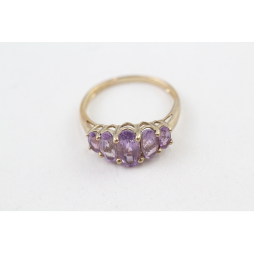 68 - 9ct gold amethyst five stone graduated dress ring (3.2g) Size  V