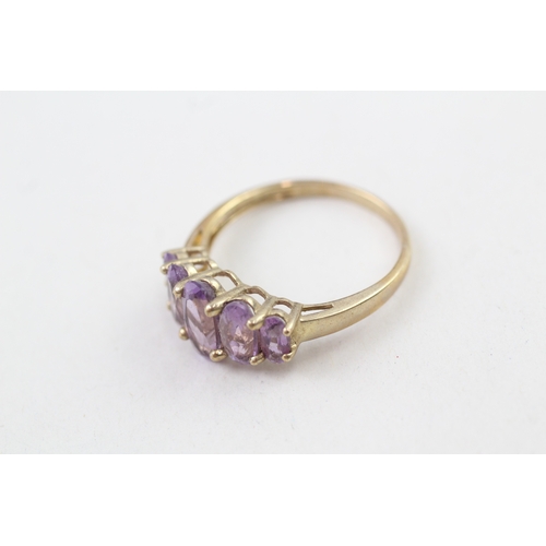 68 - 9ct gold amethyst five stone graduated dress ring (3.2g) Size  V