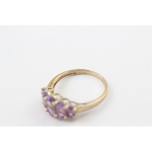 68 - 9ct gold amethyst five stone graduated dress ring (3.2g) Size  V