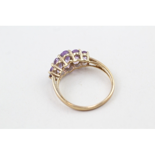 68 - 9ct gold amethyst five stone graduated dress ring (3.2g) Size  V