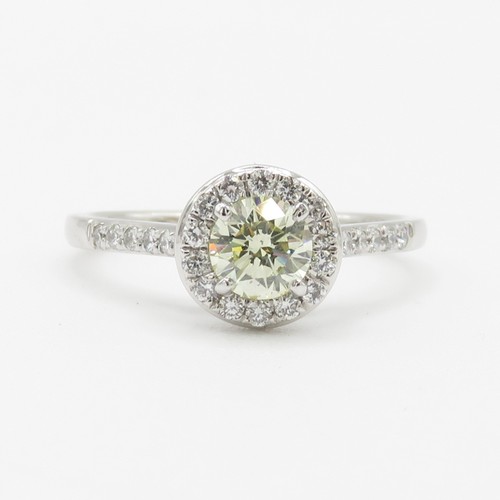 1 - Platinum Diamond Halo Ring - Set with a yellow natural earth mined diamond (0.50ct) with a hallmarke... 