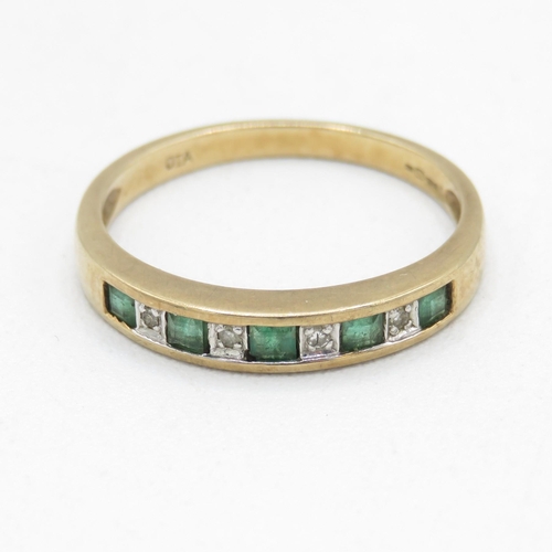 63 - 9ct gold channel set emerald and diamond half eternity dress ring (1.8g) Size  N