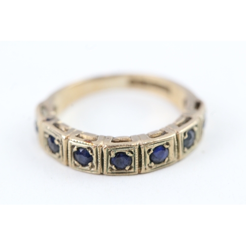 101 - 9ct gold sapphire half eternity ring (2.1g) Size  I 1/2