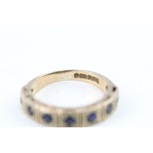 101 - 9ct gold sapphire half eternity ring (2.1g) Size  I 1/2