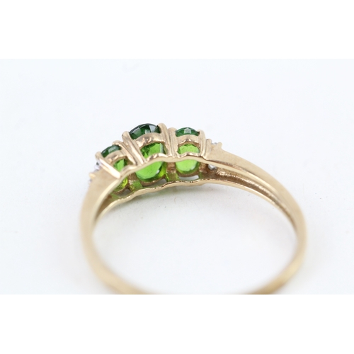 103 - 9ct gold oval cut diopside & diamond dress ring (1.5g) Size  P