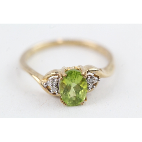 109 - 9ct gold peridot & diamond dress ring (1.6g) Size  J