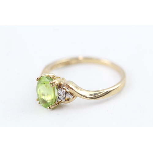 109 - 9ct gold peridot & diamond dress ring (1.6g) Size  J