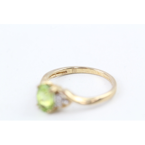 109 - 9ct gold peridot & diamond dress ring (1.6g) Size  J