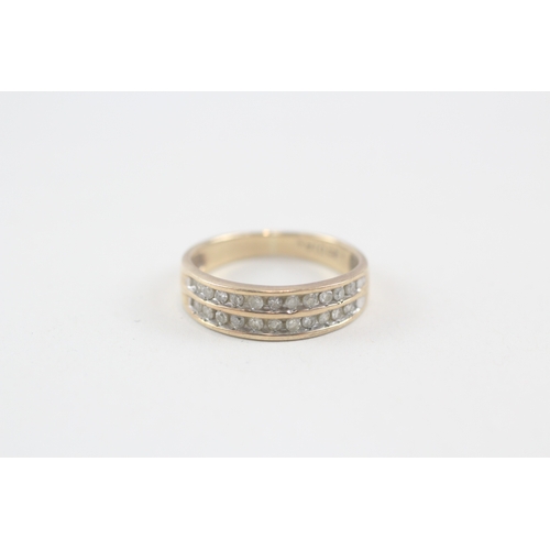 135 - 9ct gold diamond two row half eternity ring, total diamond weight: 0.25ct (approximately) (2.2g) Siz... 