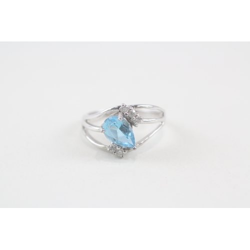 137 - 9ct gold pear cut blue topaz & diamond dress ring (3.3g) Size  N 1/2