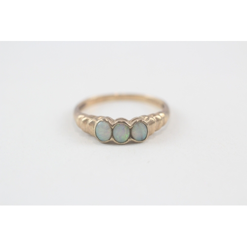 145 - 9ct gold opal three stone ring (1.6g) Size  N