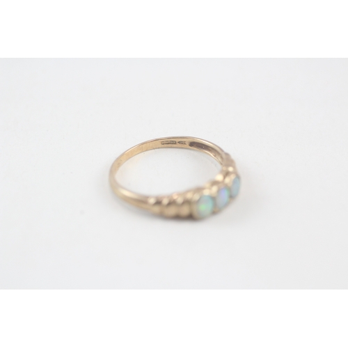 145 - 9ct gold opal three stone ring (1.6g) Size  N