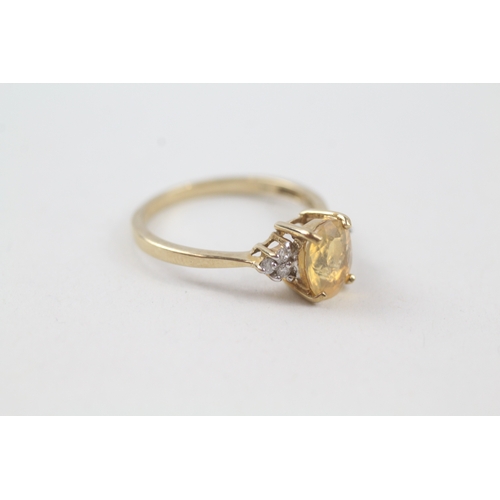 15 - 9ct gold yellow gemstone solitaire dress ring with diamond set shoulders (1.8g) Size  N 1/2