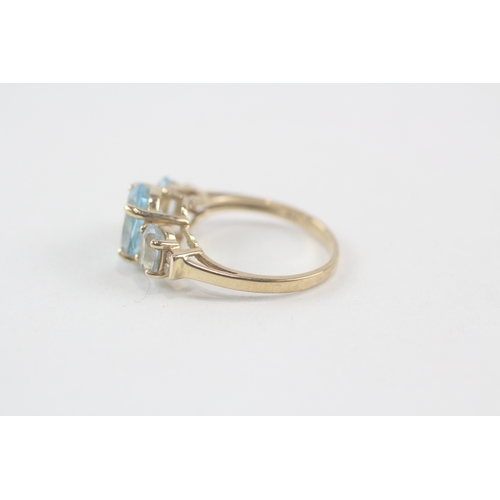 167 - 9ct gold oval cut blue topaz & diamond dress ring (2.8g) Size  M