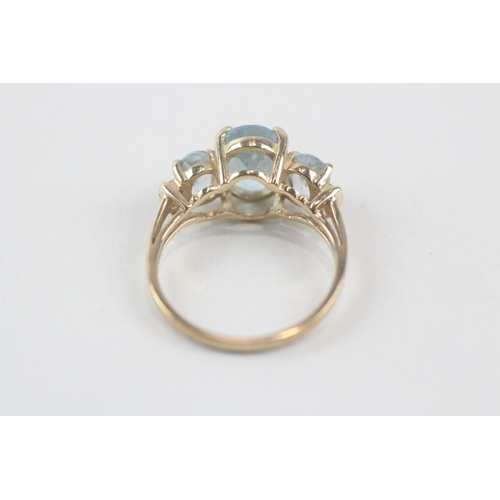 167 - 9ct gold oval cut blue topaz & diamond dress ring (2.8g) Size  M