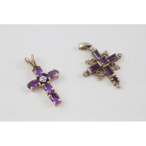 177 - 2 x 9ct gold amethyst set crucifix/ cross pendants inc diamonds (2.4g)