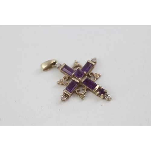 177 - 2 x 9ct gold amethyst set crucifix/ cross pendants inc diamonds (2.4g)