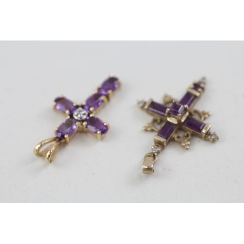 177 - 2 x 9ct gold amethyst set crucifix/ cross pendants inc diamonds (2.4g)