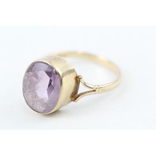 199 - 9ct gold vintage oval cut amethyst dress ring, bezel set (2.4g) Size  O 1/2