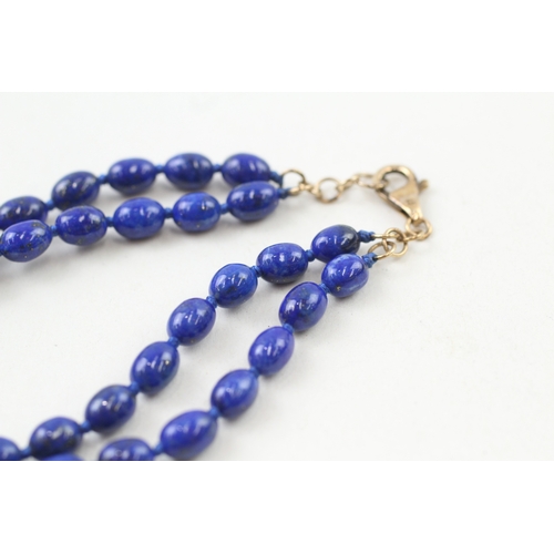 206 - 9ct gold clasp lapis lazuli beaded necklace individually knotted (12g)