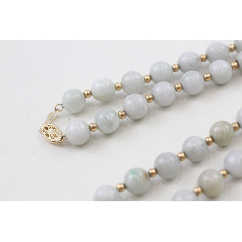 218 - 14ct gold clasped jade beaded necklace with 14ct gold spacer beads (42.3g)