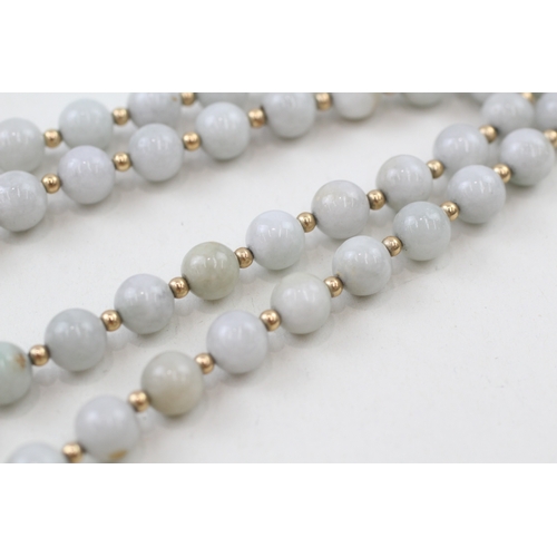 218 - 14ct gold clasped jade beaded necklace with 14ct gold spacer beads (42.3g)