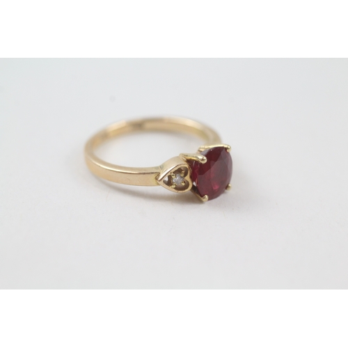 232 - 14ct gold red gemstone solitaire dress ring with diamond set heart shoulders (2.6g) Size  J 1/2