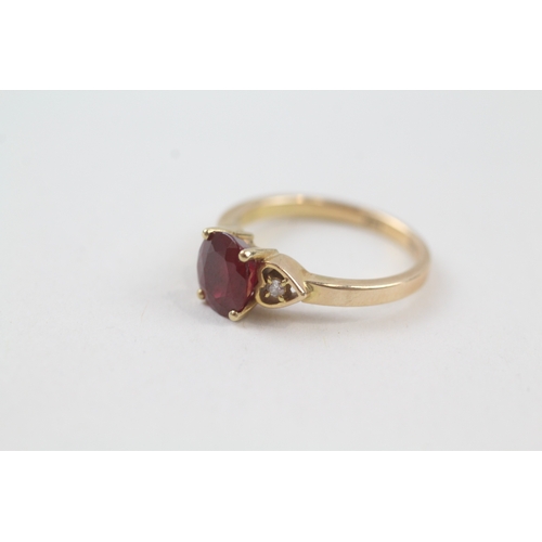 232 - 14ct gold red gemstone solitaire dress ring with diamond set heart shoulders (2.6g) Size  J 1/2