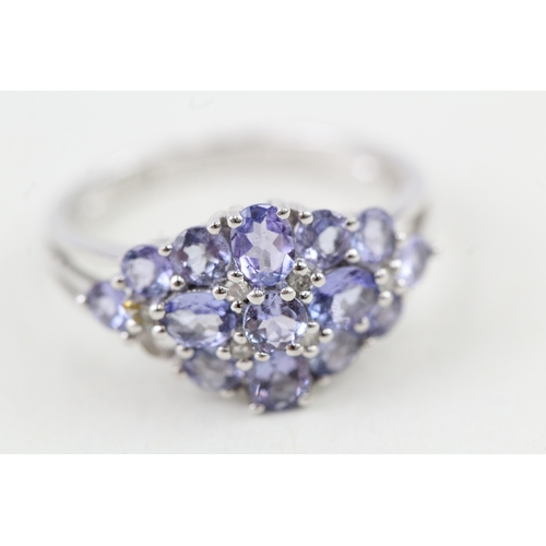 237 - 9ct gold tanzanite & diamond cluster ring (2.9g) Size  N 1/2