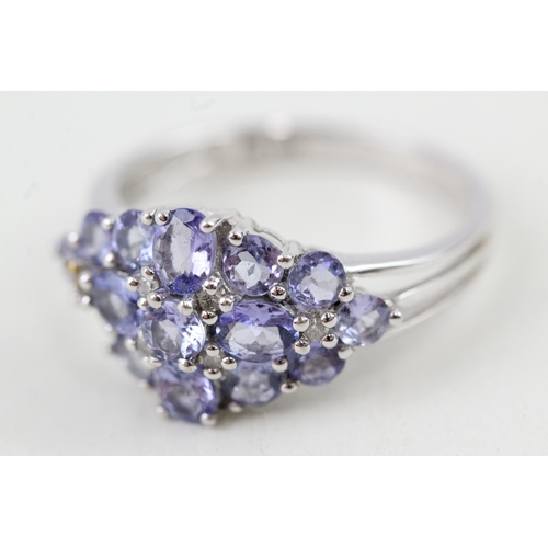 237 - 9ct gold tanzanite & diamond cluster ring (2.9g) Size  N 1/2