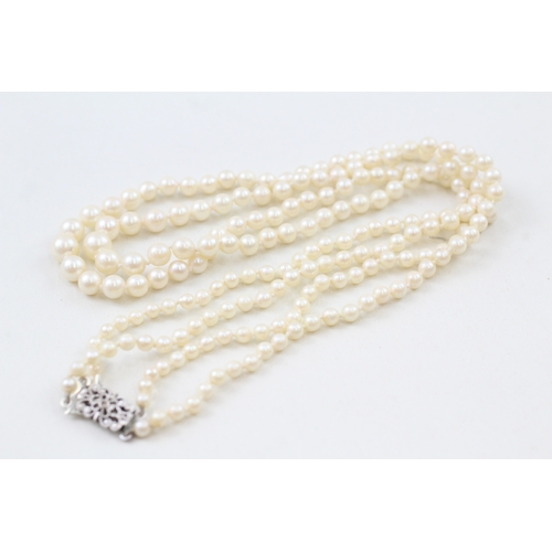 238 - 9ct white gold and white gemset clasp cultured pearl necklace (27.8g)