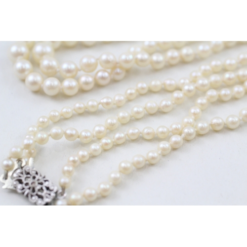 238 - 9ct white gold and white gemset clasp cultured pearl necklace (27.8g)