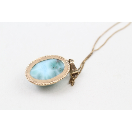 241 - 14ct gold larimar pendant with 9ct gold chain (5g)