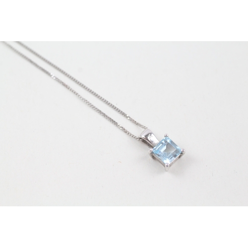 248 - 9ct white gold square cut blue topaz pendant with 9ct white gold chain (2.4g)