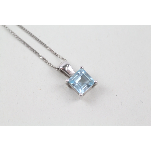 248 - 9ct white gold square cut blue topaz pendant with 9ct white gold chain (2.4g)