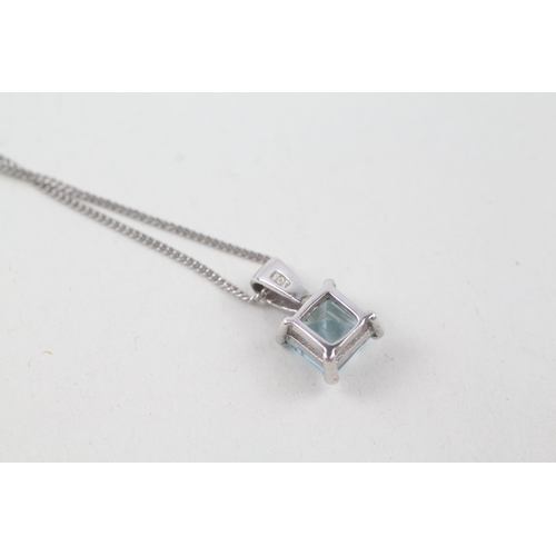 248 - 9ct white gold square cut blue topaz pendant with 9ct white gold chain (2.4g)