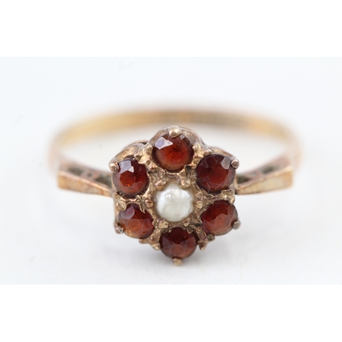 249 - 9ct gold 1970's garnet & seed pearl cluster ring (1.7g) Size  L 1/2