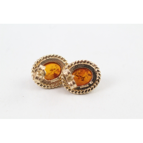 53 - 9ct gold vintage amber stud earrings with scroll backs (3.2g)