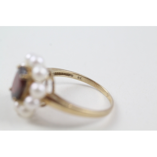 55 - 9ct gold garnet and cultured pearl halo cocktail ring (4.2g) Size  V