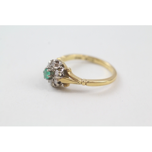 58 - 18ct gold emerald and diamond halo dress ring (3.7g) Size  M 1/2