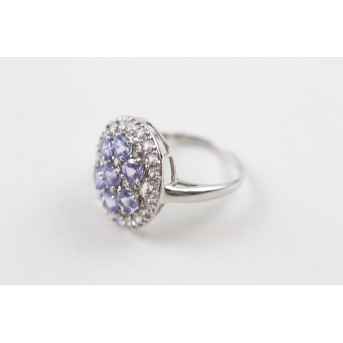 61 - 9ct white gold tanzanite and white sapphire cluster cocktail ring (3.6g) Size  O