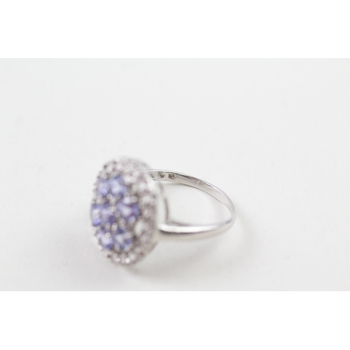 61 - 9ct white gold tanzanite and white sapphire cluster cocktail ring (3.6g) Size  O