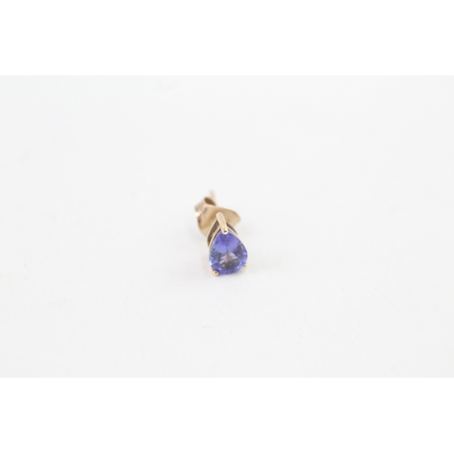 67 - 9ct gold trillion cut tanzanite stud earrings with scroll back earrings (1.1g)