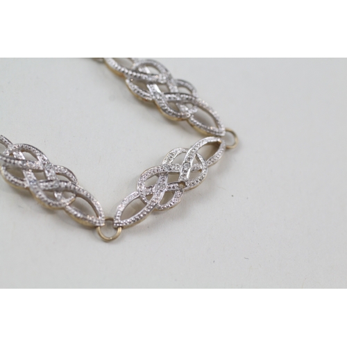 85 - 9ct gold diamond set celtic knot design bracelet (7g)