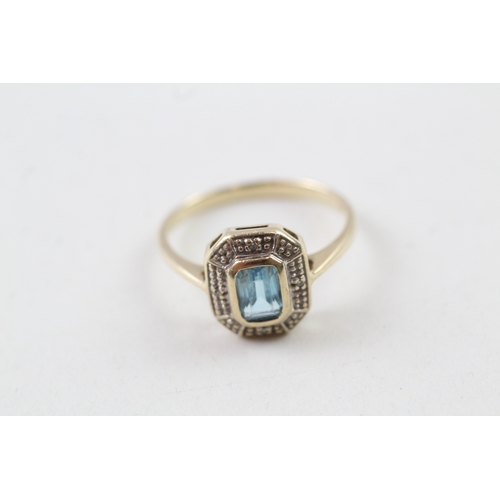 89 - 9ct gold vintage blue topaz and diamond halo dress ring (2.5g) Size  P