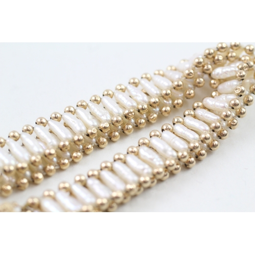 94 - 9ct gold cultured pearl beaded necklace (12.6g)