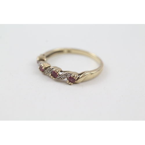 129 - 9ct gold ruby and diamond wave design dress ring (2g) Size  P 1/2